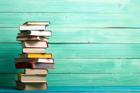 Books on wooden desk table and abstract background education background copy space back to school