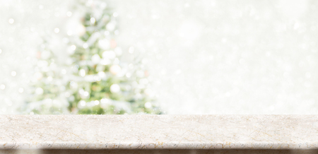 Empty Cream Marble Table Top With Abstract Muted Blur Christmas Tree And Snow Fall Background Empty Cream Marble Table Top With Abstract Muted Blur Christmas Tree And Snow Fall Background