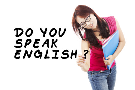 Learning language concept. Female student write Do You Speak English?