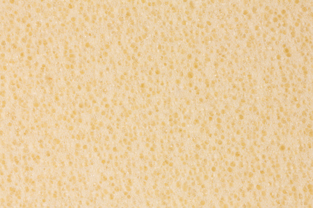 light beige foam eva texture with porous surface stock photo