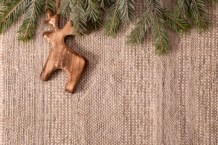 christmas decoration with fir branch and wooden deer above crafts textile background horizontal stock photo - Wooden Deer Christmas Decorations christmas decoration with fir branch and wooden deer above crafts textile background horizontal stock photo - Wooden Deer Christmas Decorations