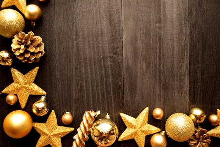 gold star shaped ornaments with christmas ornaments on black wooden background stock photo 62512629 - Black And Gold Christmas Ornaments gold star shaped ornaments with christmas ornaments on black wooden background stock photo 62512629 - Black And Gold Christmas Ornaments