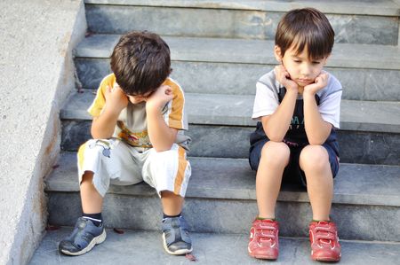 sad lonely: Two sad children on steps